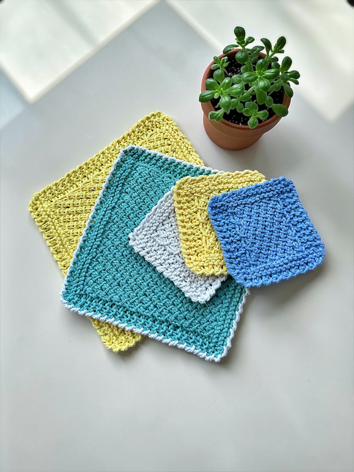 Easy knit dishcloth pattern knit flat on straight needles with textured crossed stitch and reverse crochet edging tutorial