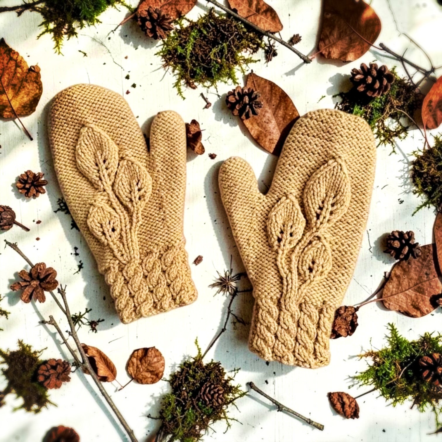 Hand knit mitts with a 3 leaf motif knitting pattern