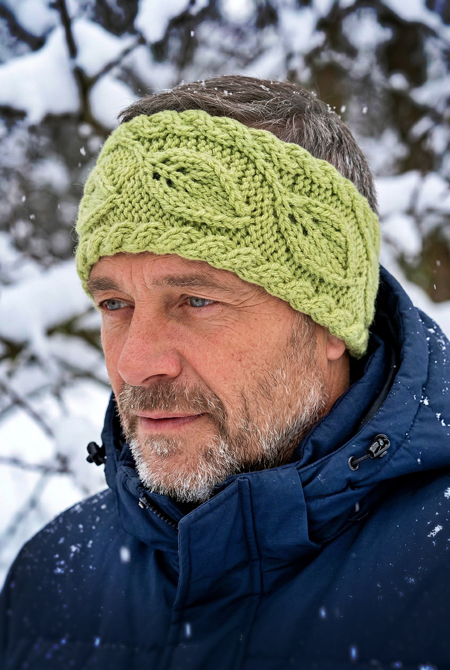 Knit flat headband showing repeating leaves design for cozy wear