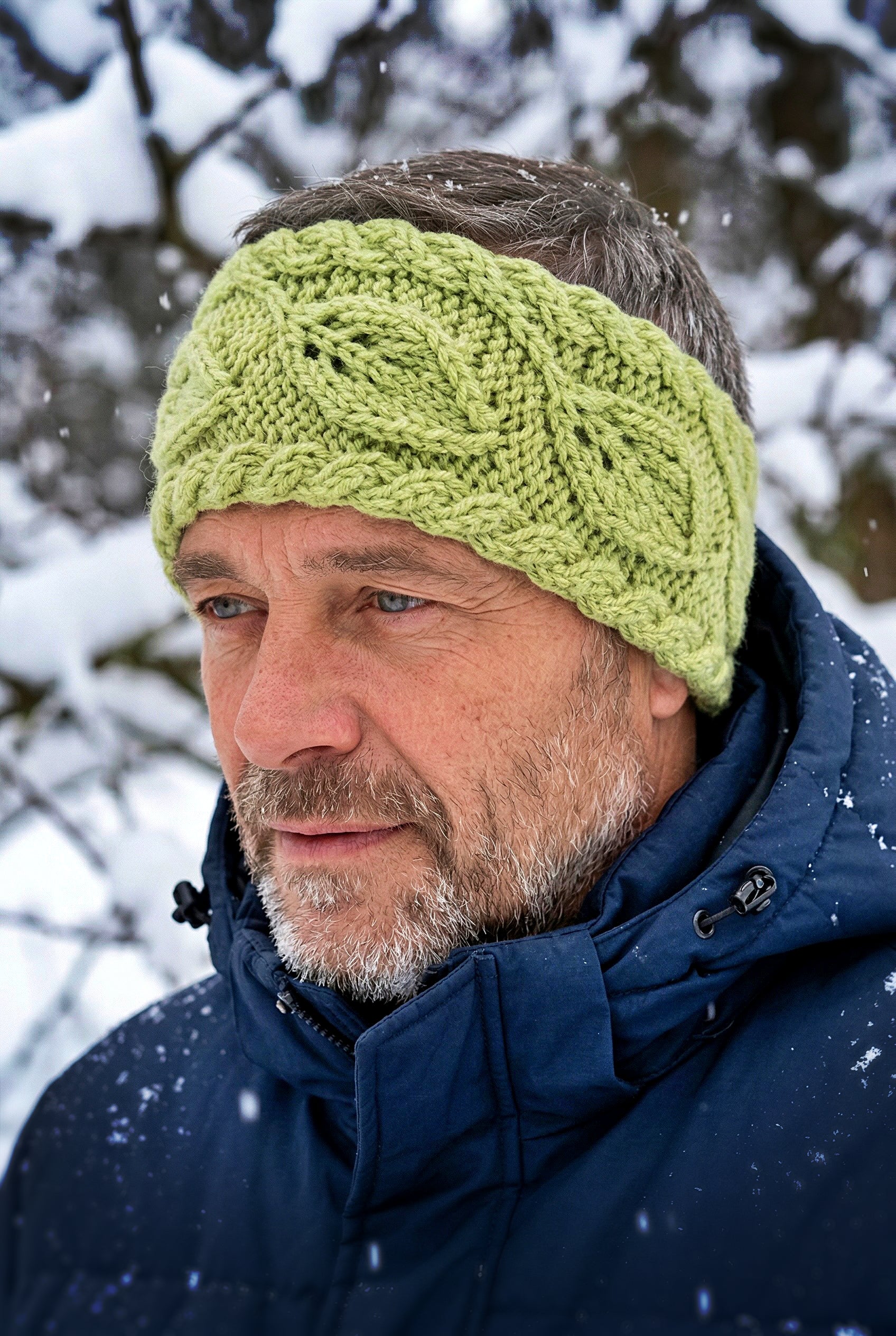 Knit flat headband showing repeating leaves design for cozy wear