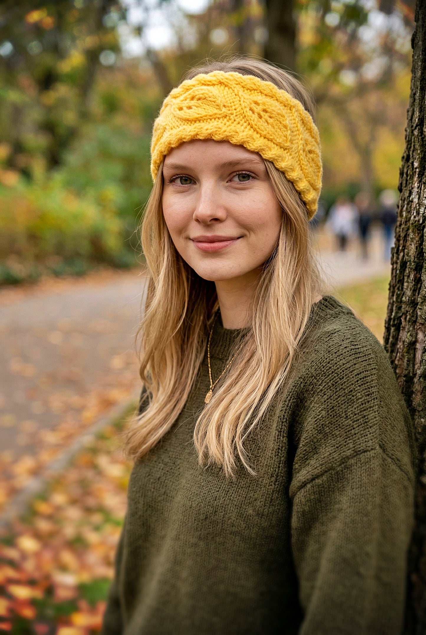Warm ear warmer with repeating leaves design perfect for fall and winter