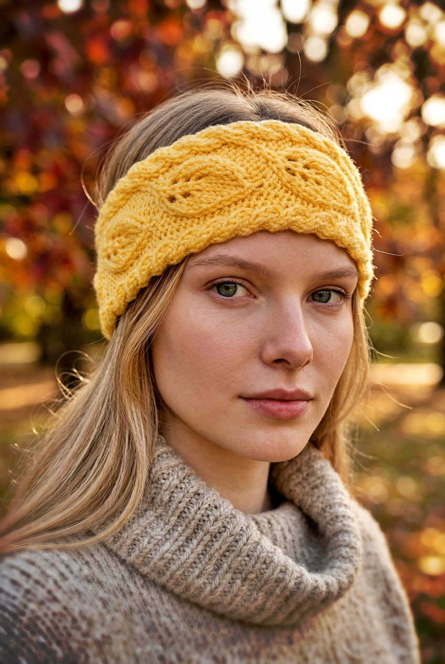 Hand knit ear warmer featuring continuous leaf motif and soft yarn