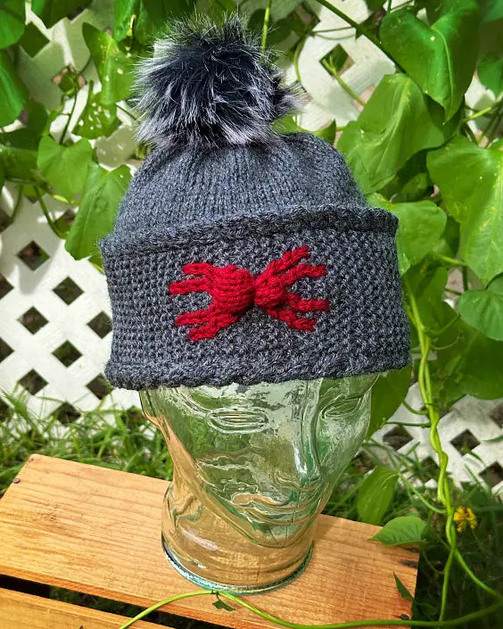 Halloween spider hat knitting pattern with detailed colour work design