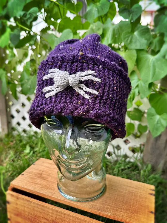 Halloween spider hat knitting pattern with detailed colourwork design