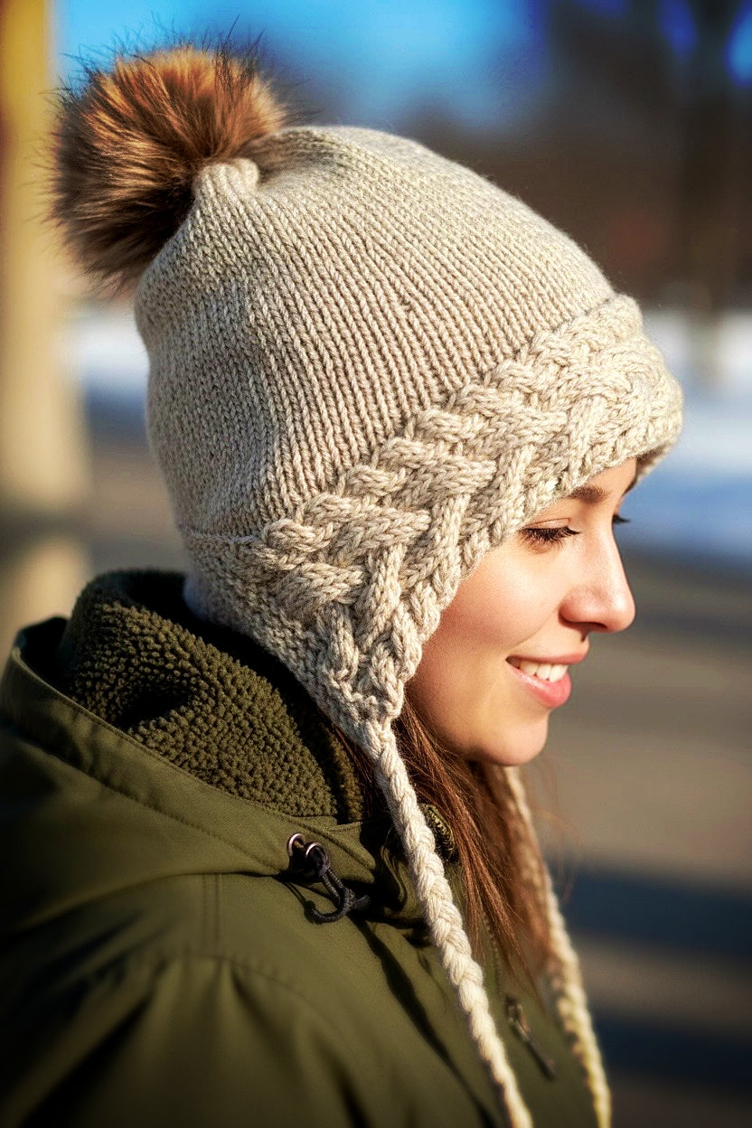 Woodland-inspired adult cable beanie with pom pom top